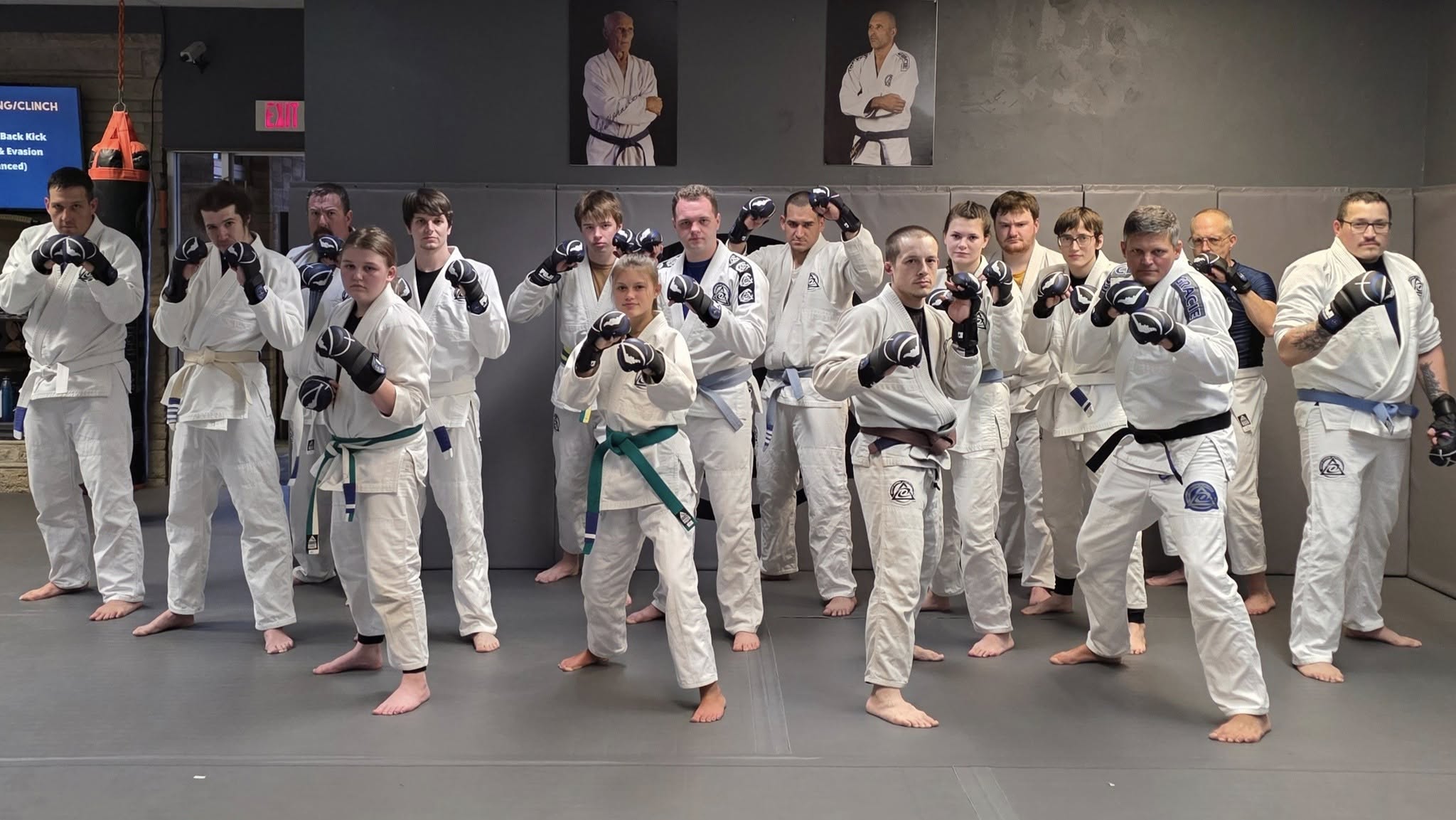 Students standing together with training gloves on